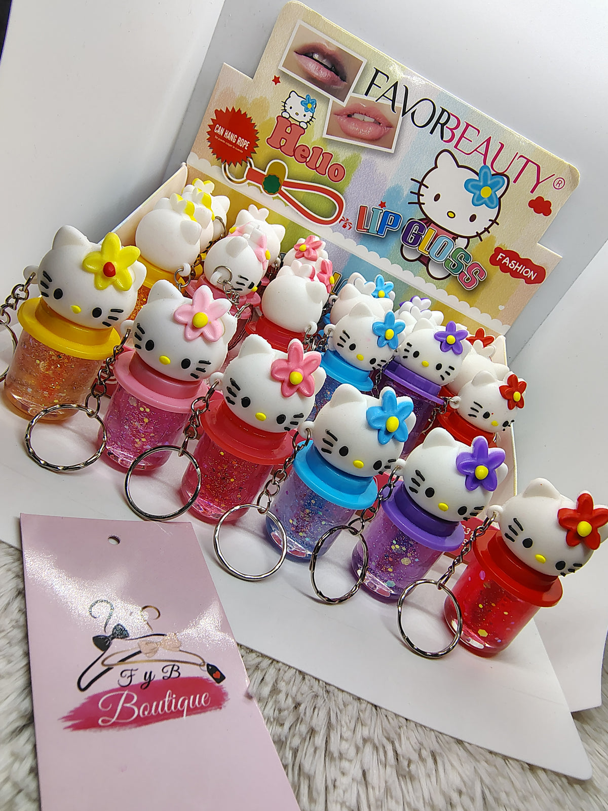 Gloss con color de Hello Kitty con llavero 💖✨